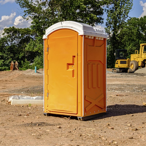 what is the cost difference between standard and deluxe porta potty rentals in Hayes Center